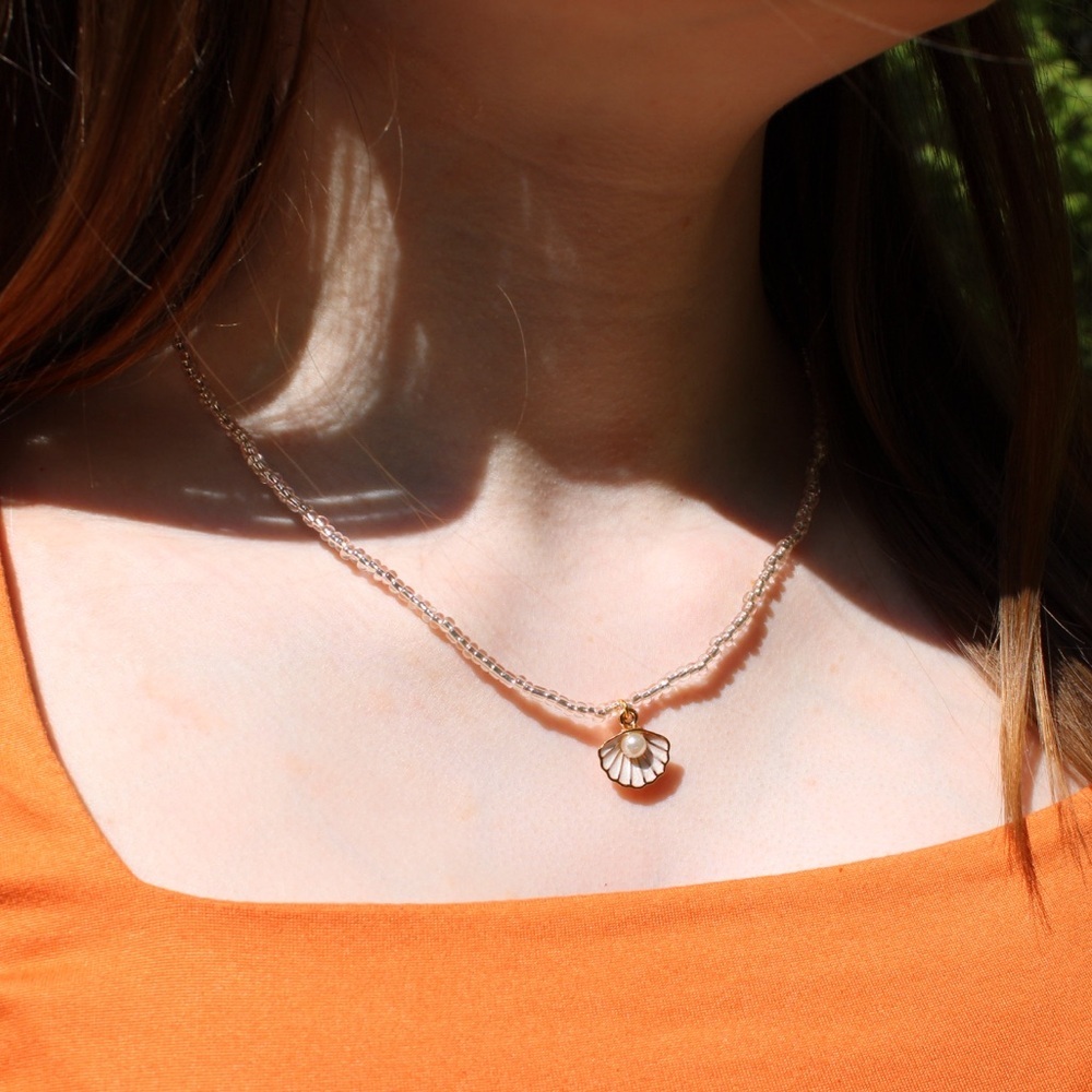 Handmade pink tinted beaded necklace gold with shell pendant